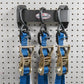 3 Heavy Duty Tie Down Straps Hung on Pegboard Wall