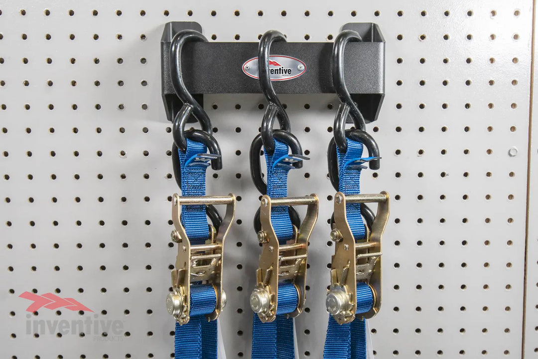 3 Heavy Duty Tie Down Straps Hung on Pegboard Wall