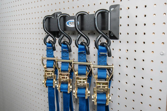 Four Tie Down Straps Hung on Pegboard Wall Mount