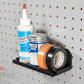 garage adhesives stored on pegboard