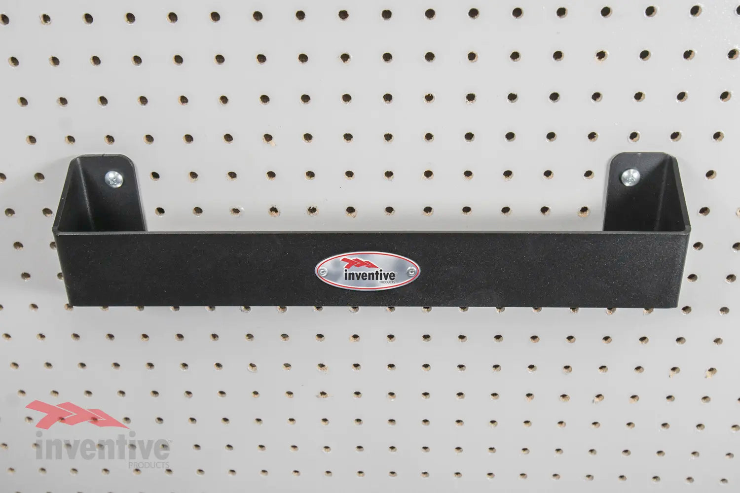 Large Metal Ratchet Strap Hanger on Pegboard Wall