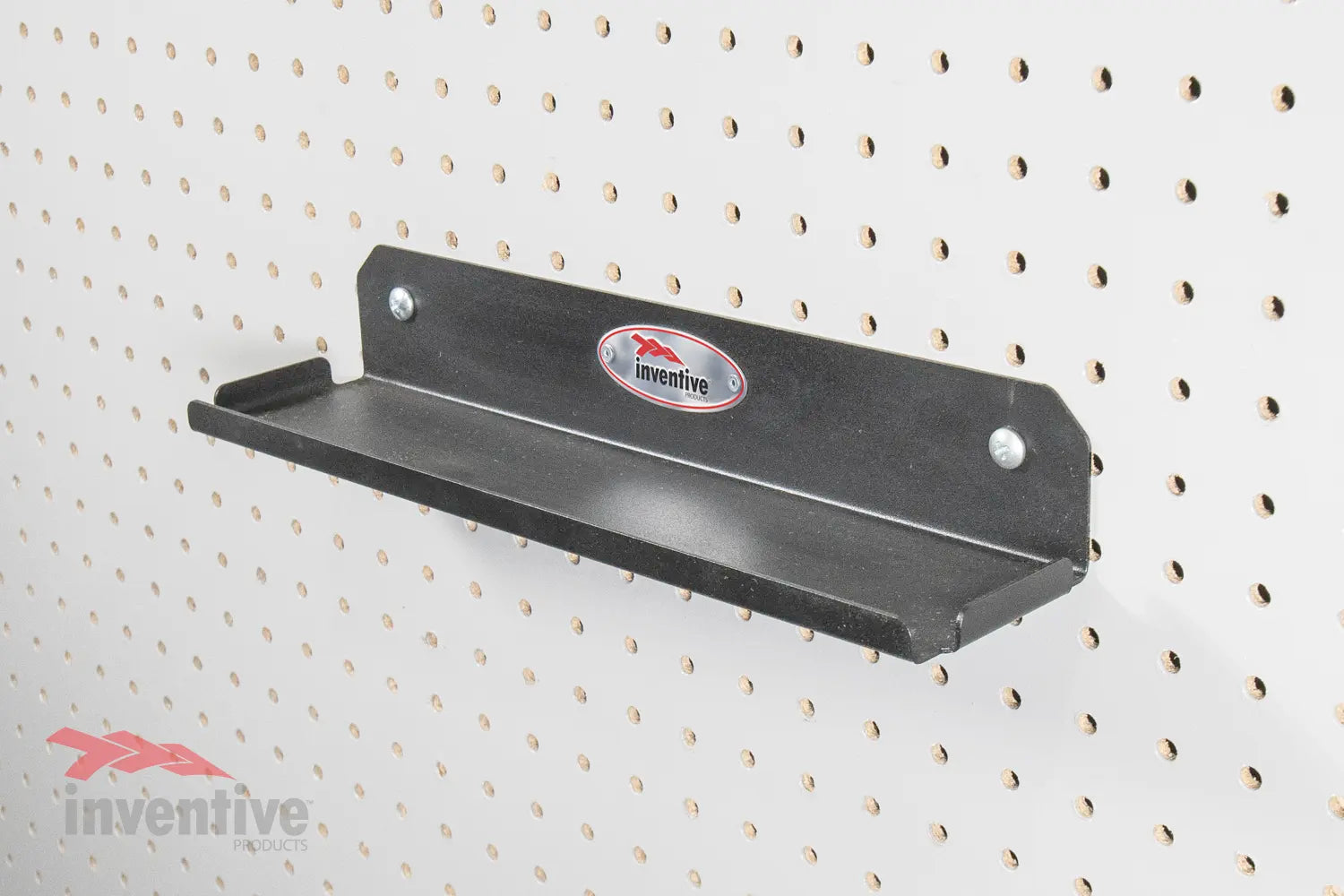 Shelf on pegboard wall