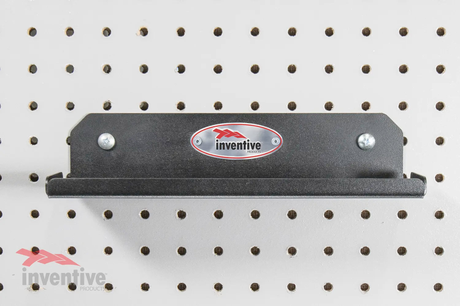 small shelf  on pegboard wall