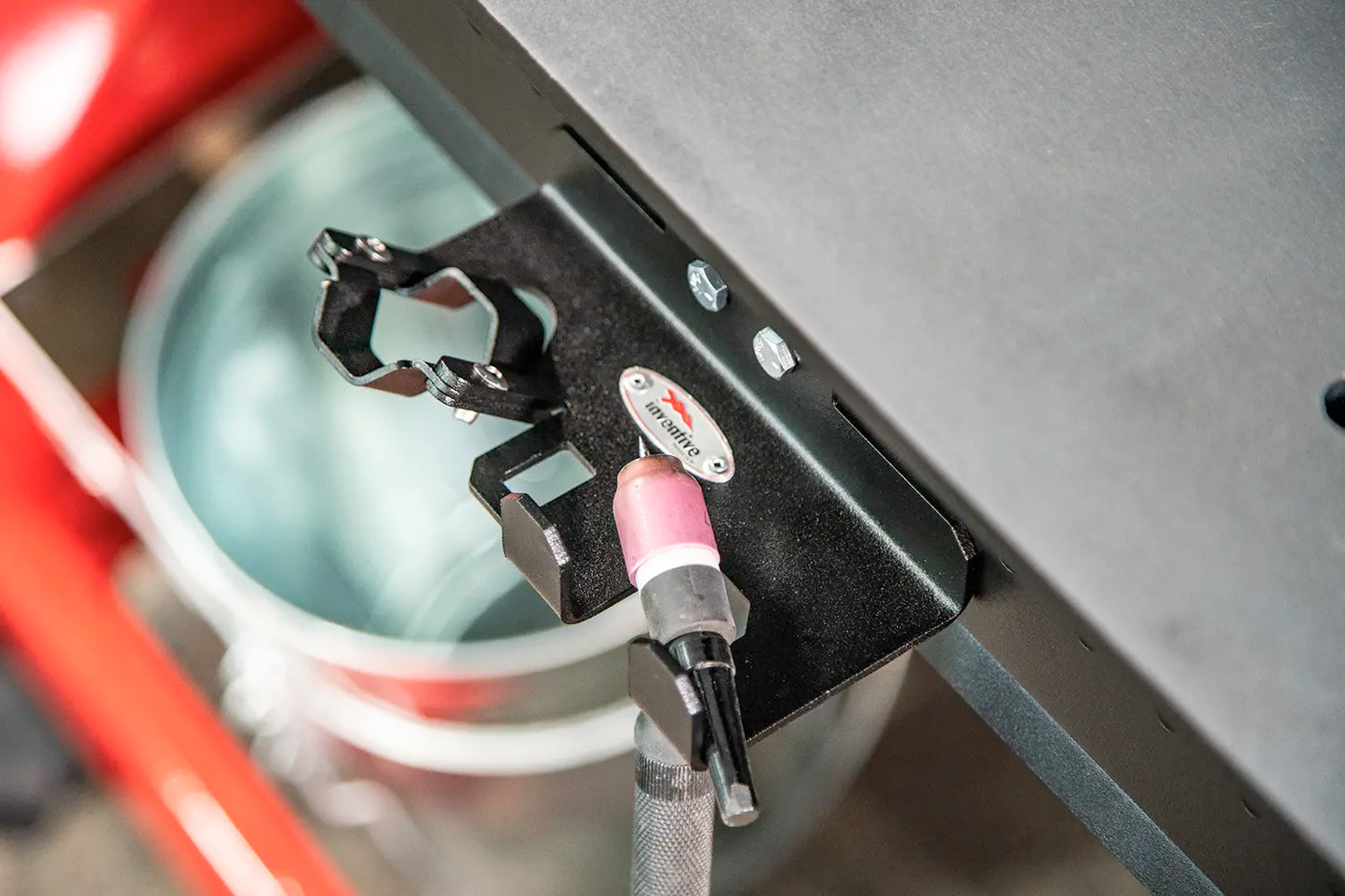 TIG torch hooked to edge of weld table