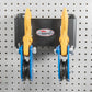 Two Snatch Blocks Mounted on Pegboard Wall