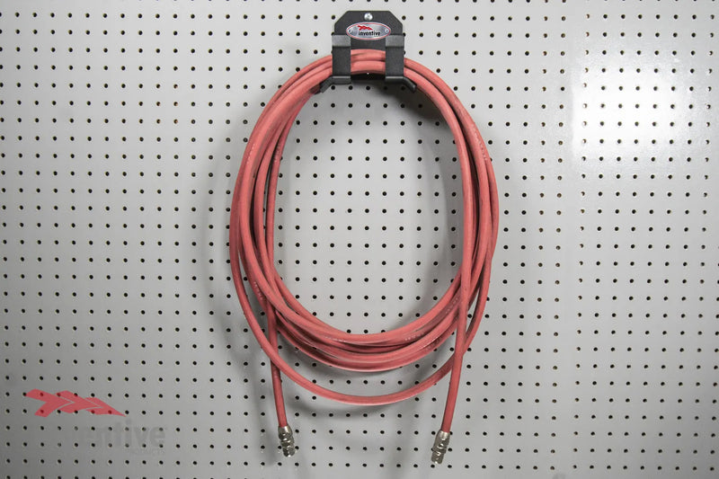 Load image into Gallery viewer, air hose storage pegboard organization
