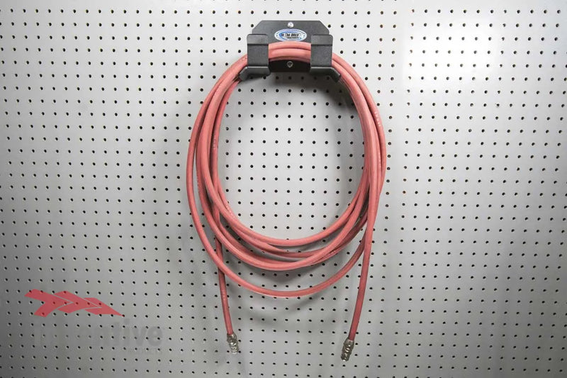 Load image into Gallery viewer, garage pegboard hose storage

