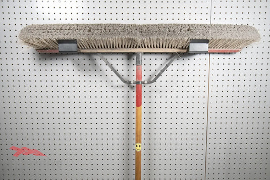 pegboard wall holder for push brooms