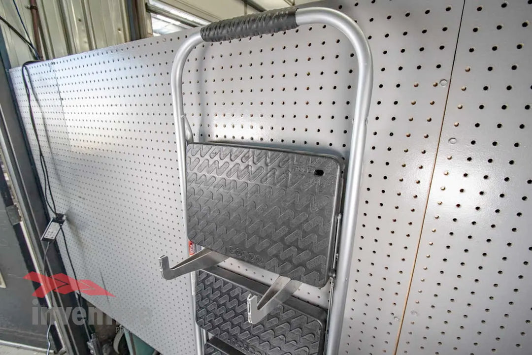 step ladder stored on pegboard