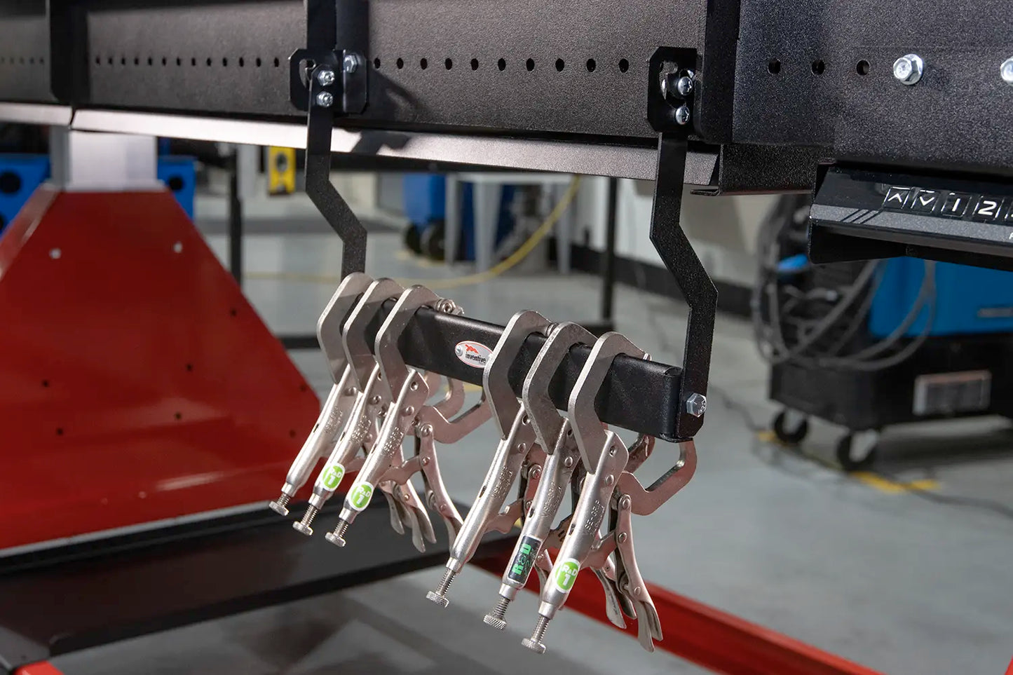 downward hanging storage to hang multiple heavy welding clamps