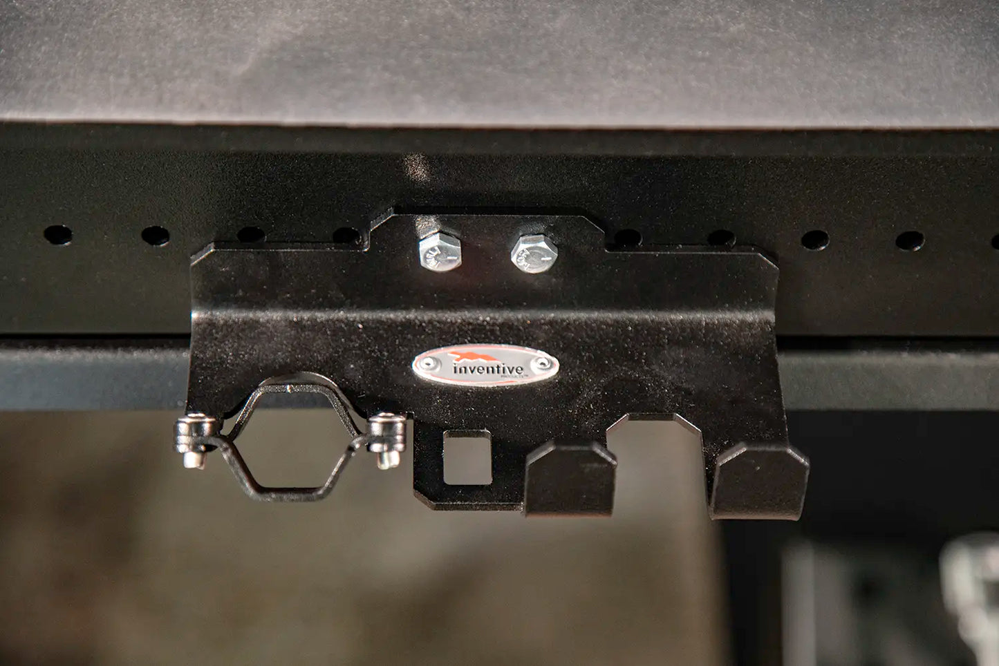 torch and plier hold bolts into side of table