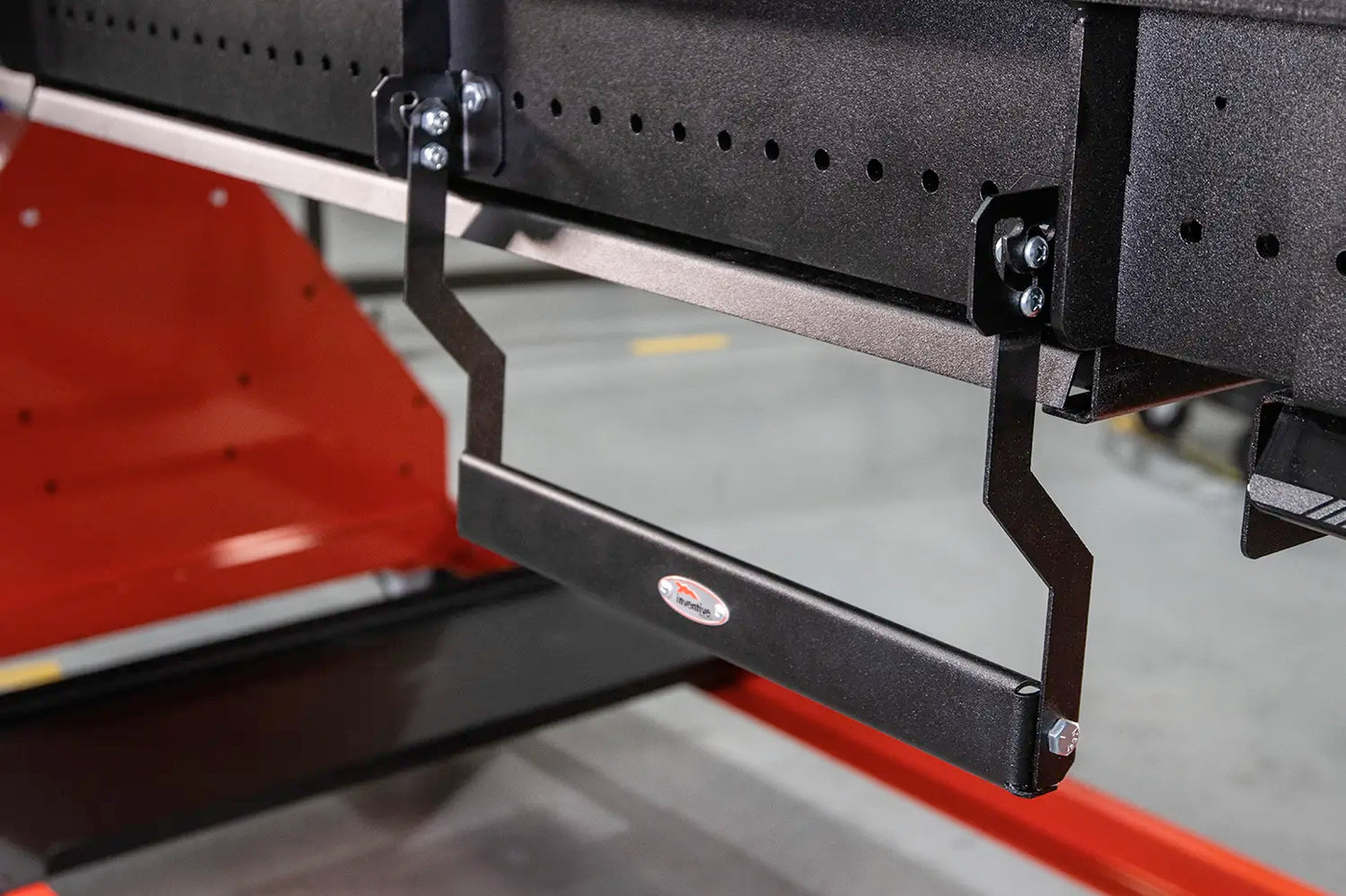 metal clamp hanger pivots downward